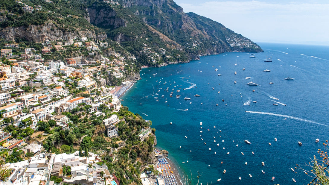a group of boats floating on top of a body of water