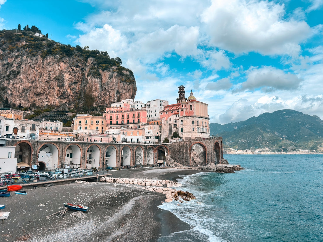 A view of a beach with a mountain in the background