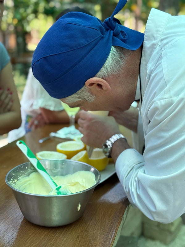 Professional chef demonstrating techniques in a gluten free cooking class on a local farm.
